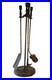 A High Quality Arts and Crafts Bronzed Iron Fireplace Tool Set