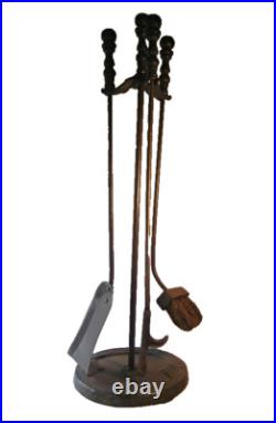 A High Quality Arts and Crafts Bronzed Iron Fireplace Tool Set