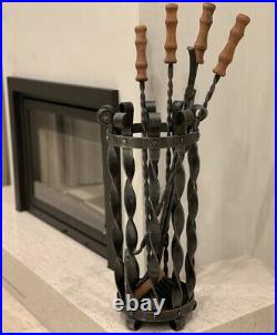 Wrought iron Fireplace set with oak handles. 4 fireplace tools in the basket